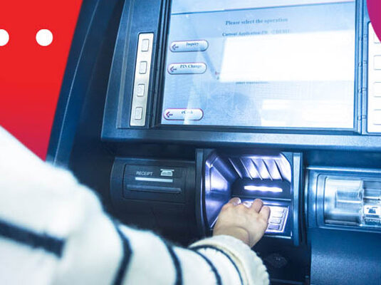 Person making use of emergency loans and withdrawing money from an ATM.